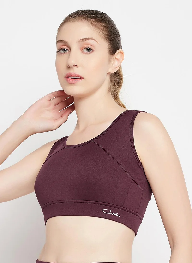 Clovia Red Medium Impact Padded Racerback Sports Bra in Maroon for Women | Best Price UAE